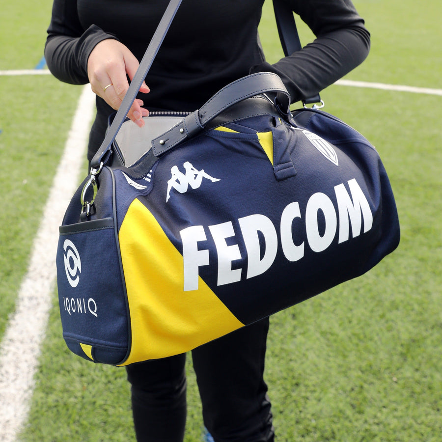 Sac en maillot extérieur de l'AS Monaco, bleu marine et jaune, sponsor Fedcom et logo Kappa